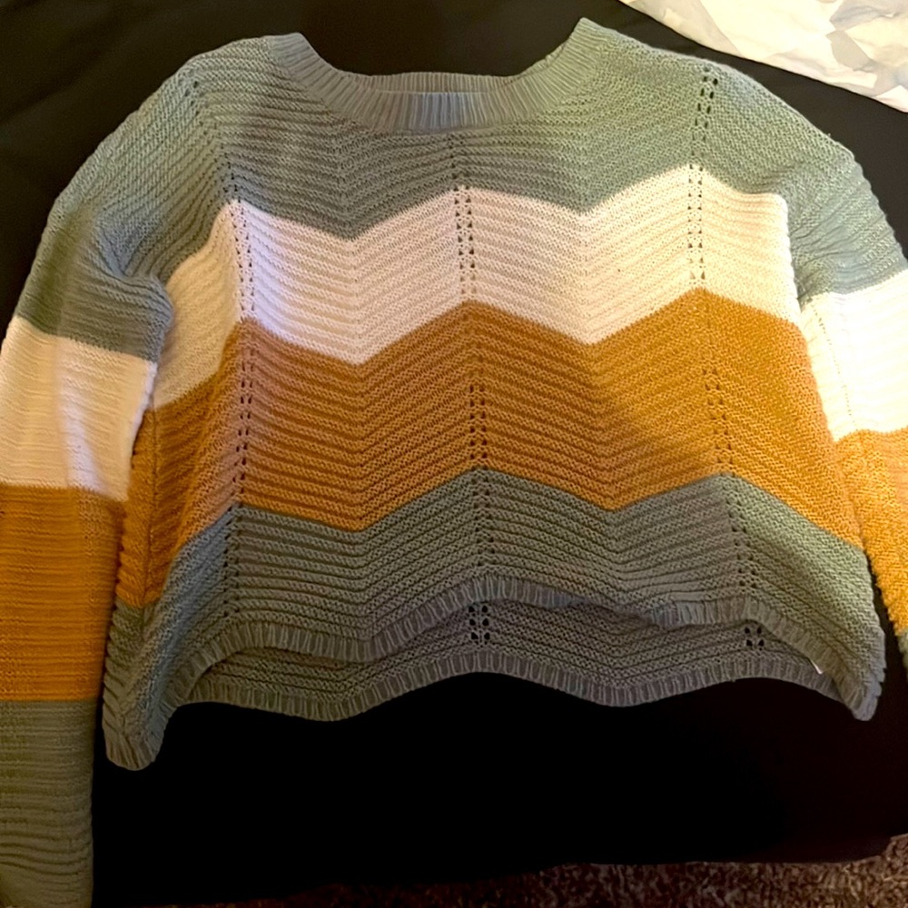 Green, gold, and white colored long sleeve barely worn good condition.